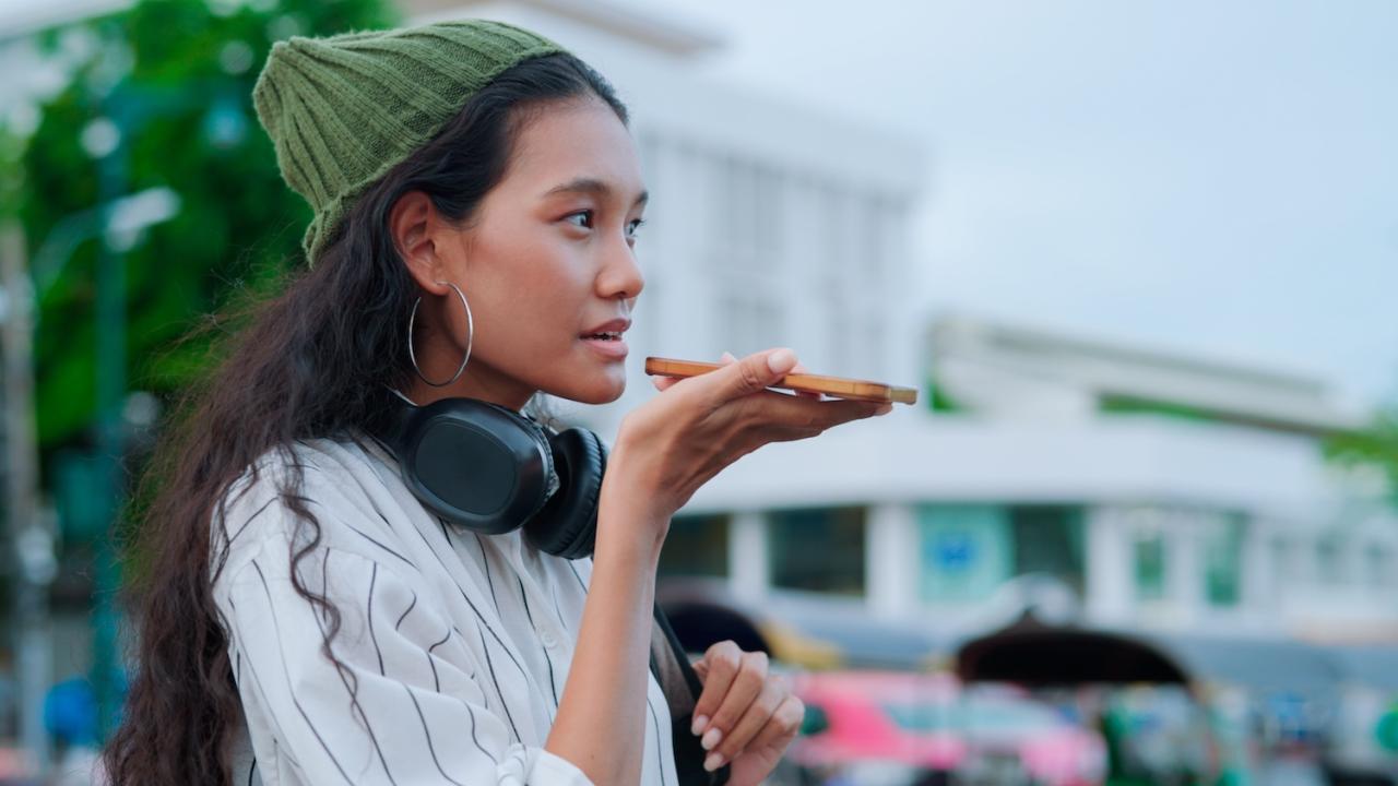 Image: woman using GenAI from phone